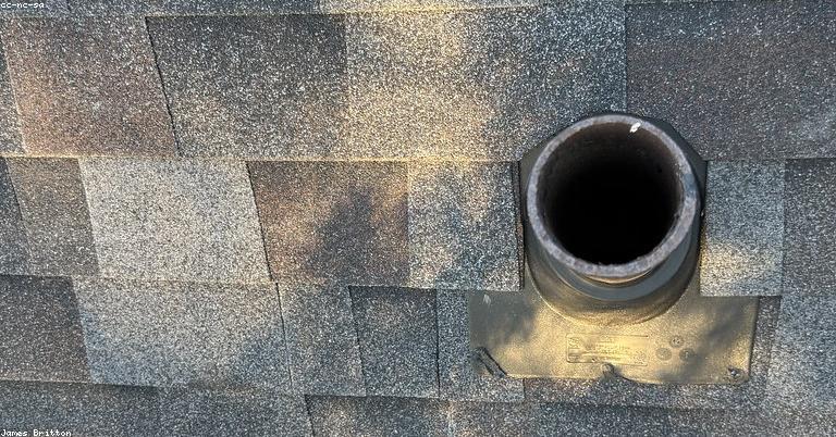 roofing contractor inspecting roof