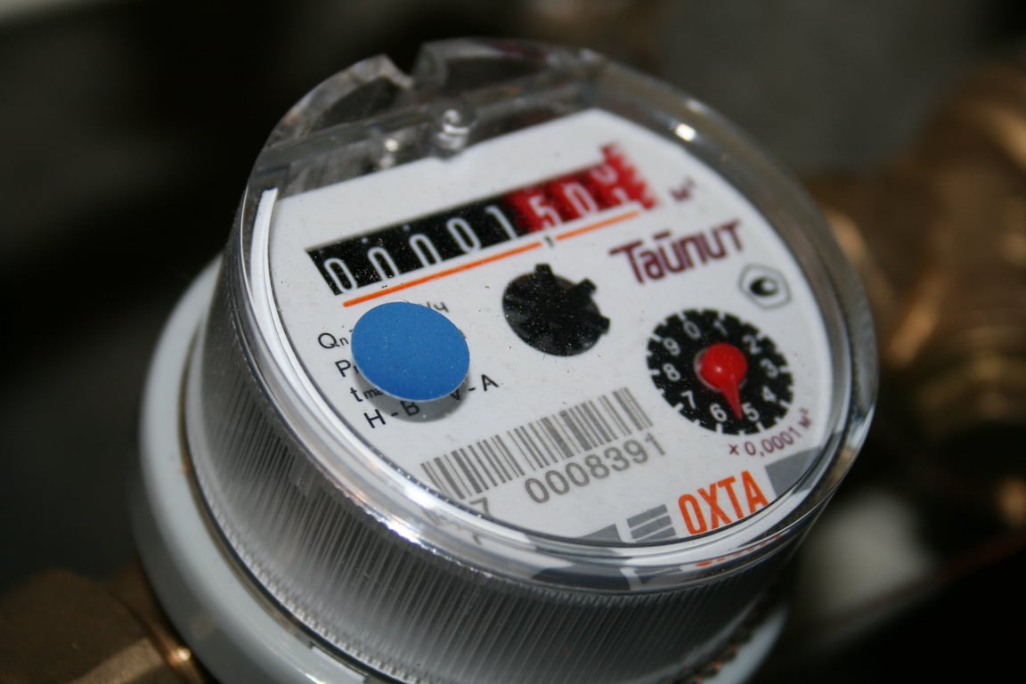 plumber checking water meter